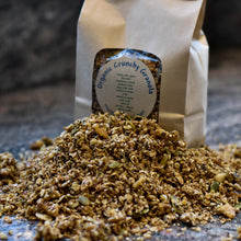 Load image into Gallery viewer, Picture of granola in front of a packaged brown bag.
